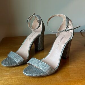 Woman’s silver size 6 high heel shoes